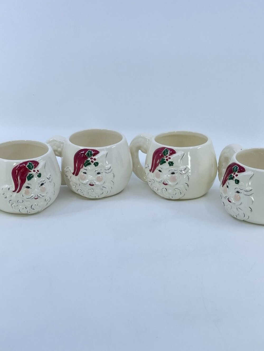 vintage kay finch winking santa mugs with hand painted details 1950s